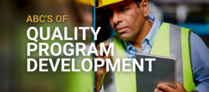 A quality inspector reviewing weld with the words,” ABCs of Quality Program Development.”